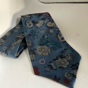 Halston tie 56.5”long basically blue with red & white flowers & black leaves
